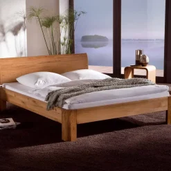 Robustes Eiche Massivholzbett Mora mit gebogenem Kopfteil Betten