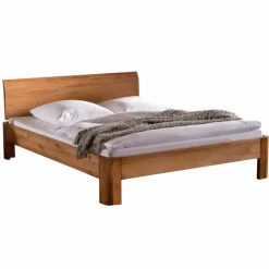 Robustes Eiche Massivholzbett Mora mit gebogenem Kopfteil Betten