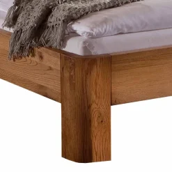 Robustes Eiche Massivholzbett Mora mit gebogenem Kopfteil Betten